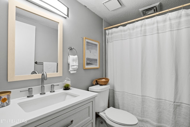 467 Canberra Dr Unit B103, Knoxville, TN 37923 - bathroom with toilet, a textured ceiling, vanity, and a shower with shower curtain