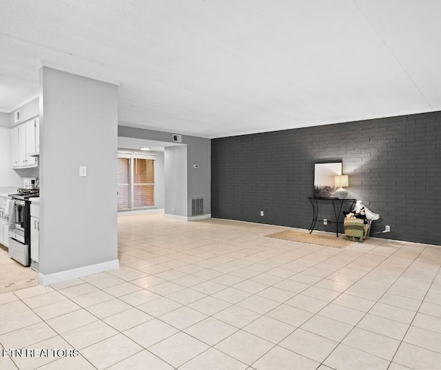 467 Canberra Dr Unit B103, Knoxville, TN 37923 - unfurnished living room featuring brick wall and baseboards