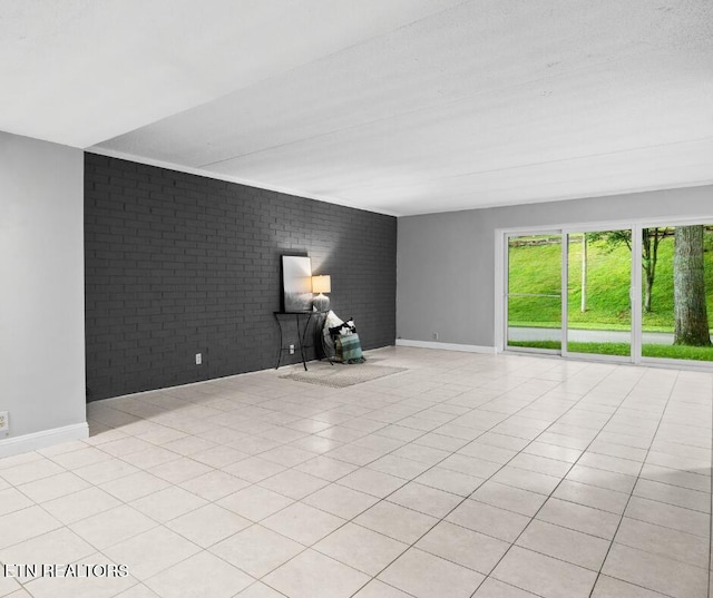467 Canberra Dr Unit B103, Knoxville, TN 37923 - empty room with brick wall, baseboards, and light tile patterned floors