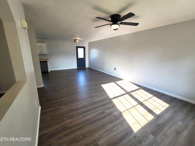 4121 Briggs Loop, Kodak, TN 37764 - unfurnished living room with dark wood-style flooring, baseboards, and a ceiling fan