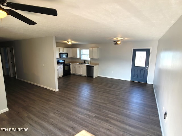 4121 Briggs Loop, Kodak, TN 37764 - unfurnished living room featuring a sink, baseboards, a ceiling fan, dark wood finished floors, and a textured ceiling