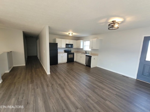 4121 Briggs Loop, Kodak, TN 37764 - kitchen featuring black appliances, a sink, light countertops, baseboards, and white cabinets