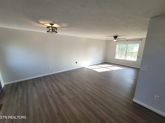 4121 Briggs Loop, Kodak, TN 37764 - empty room with baseboards, dark wood-style floors, a ceiling fan, and a textured ceiling