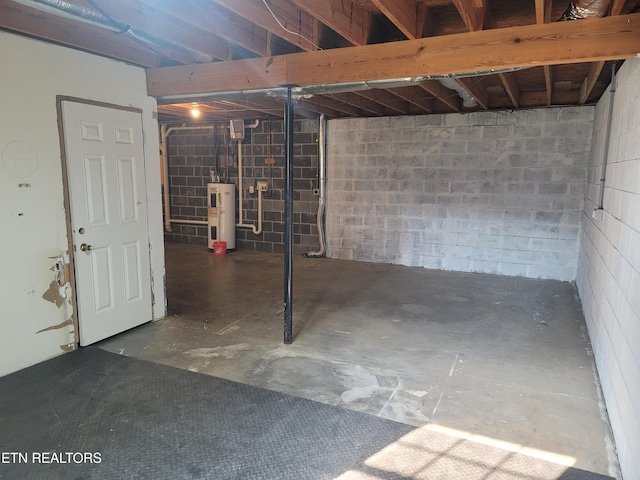 4121 Briggs Loop, Kodak, TN 37764 - unfinished basement featuring water heater and concrete block wall