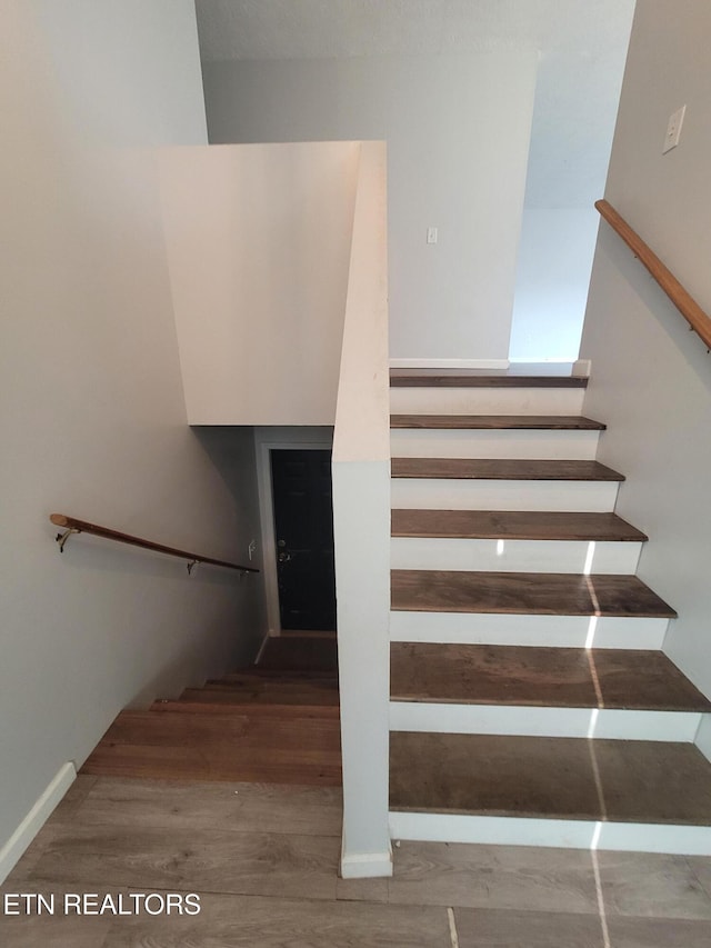 4121 Briggs Loop, Kodak, TN 37764 - stairs featuring wood finished floors and baseboards