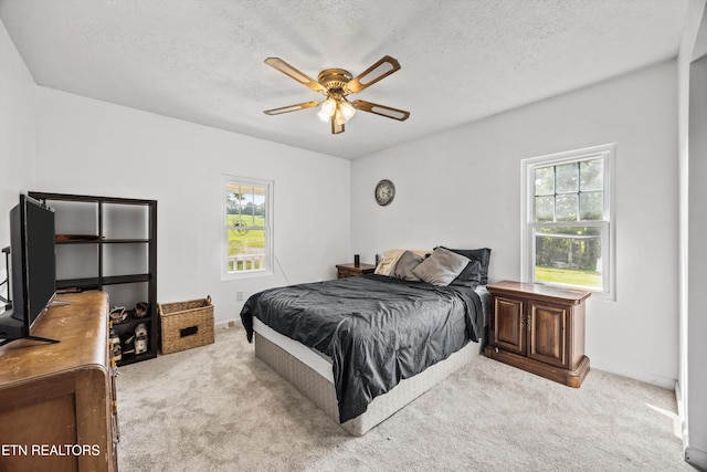 168 Boatman Rd, Cookeville, TN 38506 - carpeted bedroom featuring a textured ceiling, a ceiling fan, and baseboards