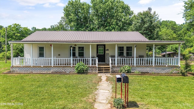 168 Boatman Rd, Cookeville, TN 38506 - farmhouse-style home with a porch, a front yard, and metal roof