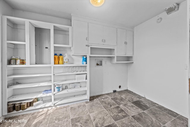 168 Boatman Rd, Cookeville, TN 38506 - laundry room with washer hookup, electric dryer hookup, dark stone finish flooring, and cabinet space