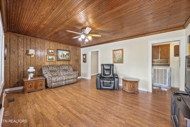 168 Boatman Rd, Cookeville, TN 38506 - living room with ceiling fan, wooden ceiling, wood finished floors, ornamental molding, and wooden walls