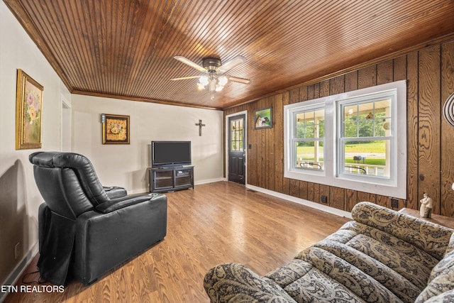 168 Boatman Rd, Cookeville, TN 38506 - living area featuring a ceiling fan, ornamental molding, baseboards, wooden walls, and wood finished floors