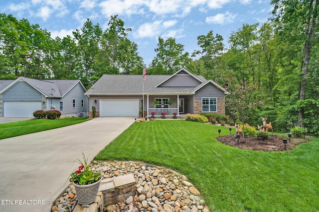 247 Thrushwood Dr, Fairfield Glade, TN 38558 - single story home with covered porch, an attached garage, concrete driveway, and a front yard