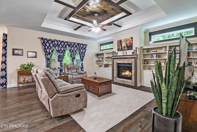 247 Thrushwood Dr, Fairfield Glade, TN 38558 - living area featuring ornamental molding, a glass covered fireplace, plenty of natural light, a ceiling fan, and wood finished floors