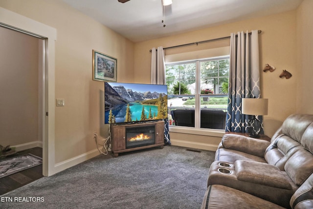 247 Thrushwood Dr, Fairfield Glade, TN 38558 - living area featuring a fireplace, a ceiling fan, baseboards, and carpet flooring
