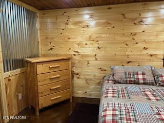 138 Matthews Rd, Oneida, TN 37841 - bedroom featuring wooden ceiling, dark wood-style floors, and wooden walls