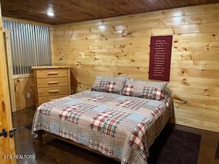 138 Matthews Rd, Oneida, TN 37841 - bedroom featuring wooden ceiling, wooden walls, and wood finished floors