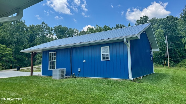 138 Matthews Rd, Oneida, TN 37841 - view of side of property with metal roof, a lawn, and central air condition unit