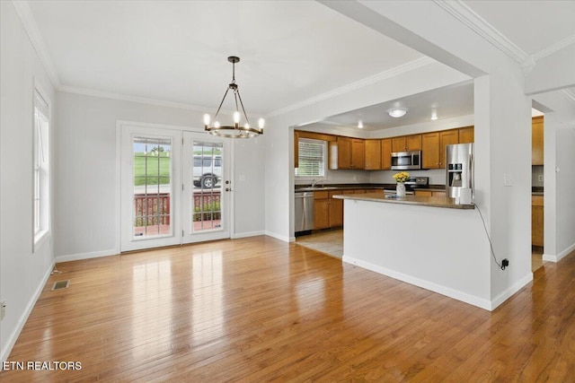 262 Cresent St, Harrogate, TN 37752 - kitchen with stainless steel appliances, light wood-style floors, a chandelier, and crown molding