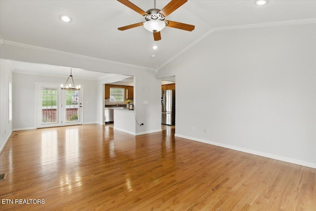262 Cresent St, Harrogate, TN 37752 - unfurnished living room with a chandelier, a ceiling fan, light wood finished floors, lofted ceiling, and crown molding