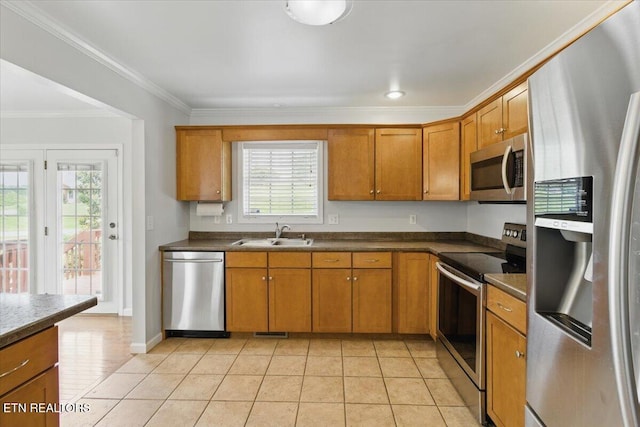 262 Cresent St, Harrogate, TN 37752 - kitchen featuring appliances with stainless steel finishes, a sink, crown molding, and brown cabinets