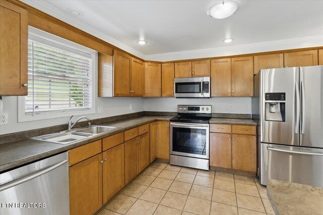 262 Cresent St, Harrogate, TN 37752 - kitchen featuring stainless steel appliances, a sink, brown cabinetry, light tile patterned flooring, and crown molding