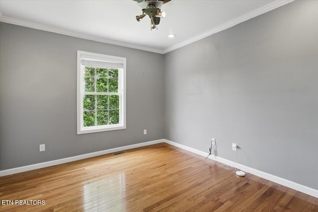 262 Cresent St, Harrogate, TN 37752 - spare room featuring ceiling fan, wood finished floors, crown molding, and baseboards