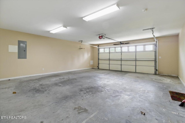 262 Cresent St, Harrogate, TN 37752 - garage with electric panel, a garage door opener, and baseboards