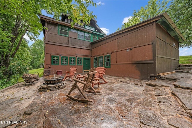 158 Dillon Rd, Baxter, TN 38544 - back of property featuring a fire pit and a patio area