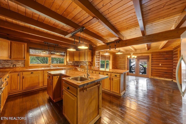 158 Dillon Rd, Baxter, TN 38544 - kitchen with a center island with sink, a sink, wood ceiling with exposed beams, healthy amount of natural light, and dark wood-style flooring