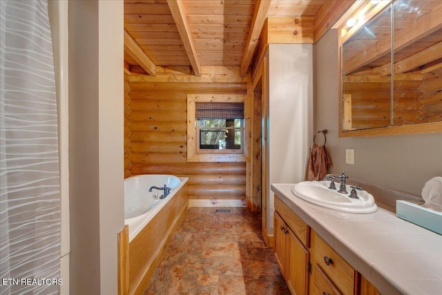 158 Dillon Rd, Baxter, TN 38544 - full bathroom with rustic walls, wooden ceiling with exposed beams, vanity, a bath, and stone finish flooring