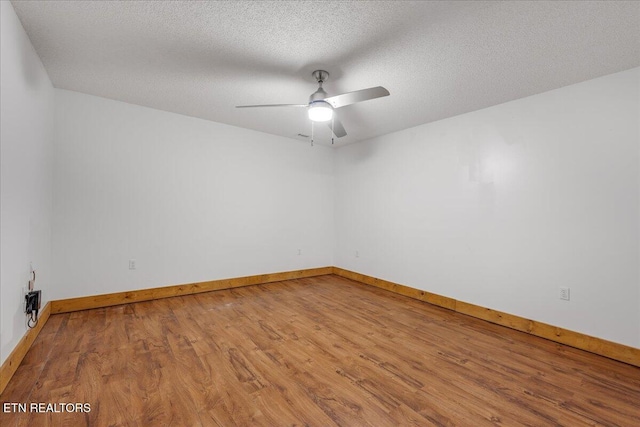 158 Dillon Rd, Baxter, TN 38544 - unfurnished room featuring wood finished floors, ceiling fan, baseboards, and a textured ceiling