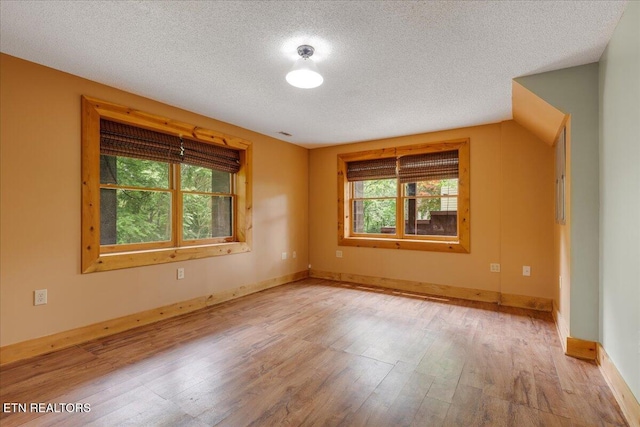 158 Dillon Rd, Baxter, TN 38544 - unfurnished room with wood finished floors, a textured ceiling, and baseboards