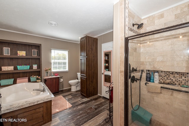 1193 Johnson Rd, Seymour, TN 37865 - full bath with a stall shower, a garden tub, wood finished floors, ornamental molding, and toilet