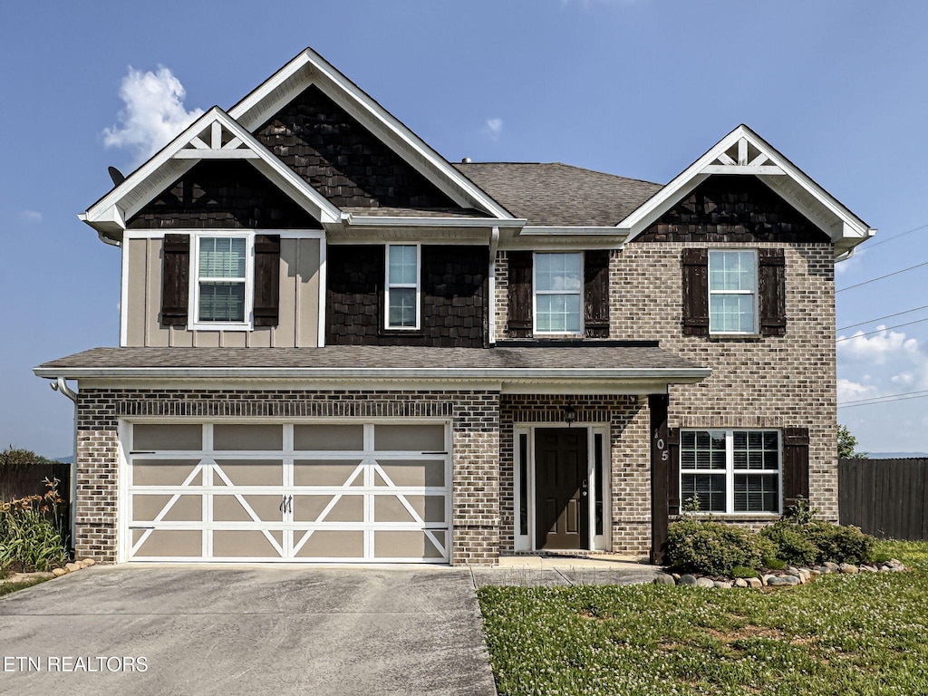 105 Ollies St, Maryville, TN 37804 - view of front of home featuring concrete driveway, an attached garage, and brick siding