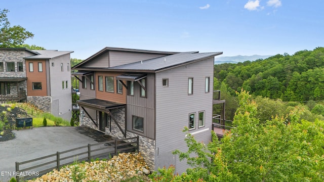 2955 Lightning Strike Dr, Sevierville, TN 37862 - back of house with stone siding and a patio area