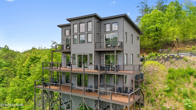 2955 Lightning Strike Dr, Sevierville, TN 37862 - rear view of house with a balcony and a wooden deck