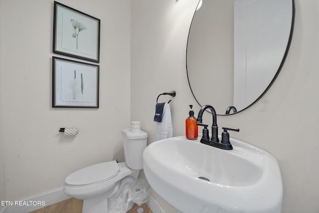 2955 Lightning Strike Dr, Sevierville, TN 37862 - bathroom featuring a sink, toilet, and baseboards