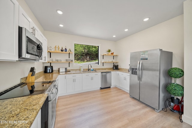 2955 Lightning Strike Dr, Sevierville, TN 37862 - kitchen with stainless steel appliances, open shelves, a sink, light stone counters, and recessed lighting