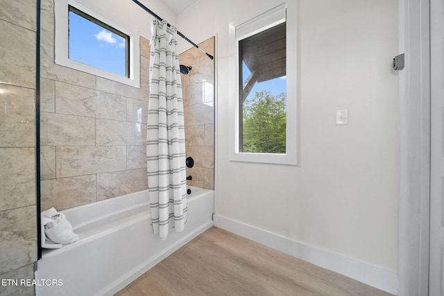 2955 Lightning Strike Dr, Sevierville, TN 37862 - full bath featuring shower / tub combo with curtain, wood finished floors, and baseboards