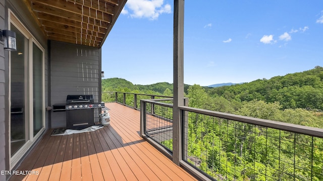 2955 Lightning Strike Dr, Sevierville, TN 37862 - wooden terrace with a forest view and grilling area