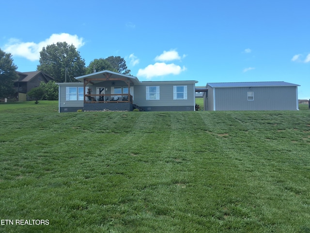 1748 Circle Lake Dr, Dandridge, TN 37725 - back of house featuring a lawn