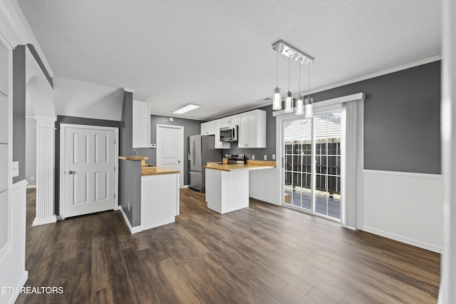 10548 Lone Star Way, Knoxville, TN 37932 - kitchen with wood counters, stainless steel appliances, a textured ceiling, white cabinets, and dark wood-style floors