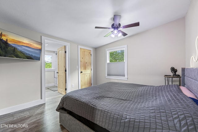 4509 Lifford Ln, Corryton, TN 37721 - bedroom featuring wood finished floors, baseboards, ceiling fan, and ensuite bathroom