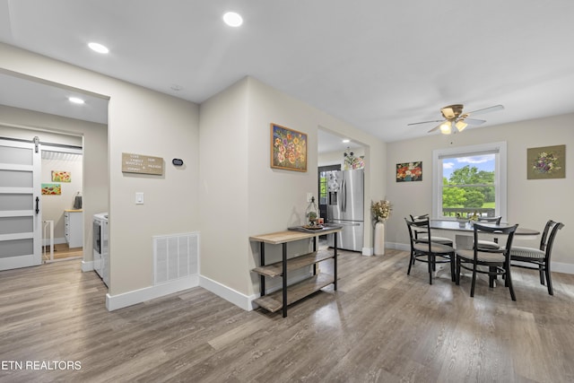 4509 Lifford Ln, Corryton, TN 37721 - dining area featuring a barn door, wood finished floors, baseboards, a ceiling fan, and recessed lighting