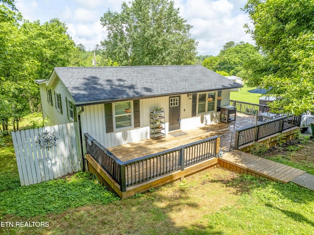 4509 Lifford Ln, Corryton, TN 37721 - back of property featuring roof with shingles, a lawn, and a wooden deck