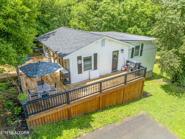 4509 Lifford Ln, Corryton, TN 37721 - back of house with a shingled roof, a wooden deck, and a lawn