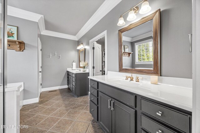 12332 Bonnybridge Ln, Knoxville, TN 37922 - full bathroom with two vanities, ornamental molding, and baseboards