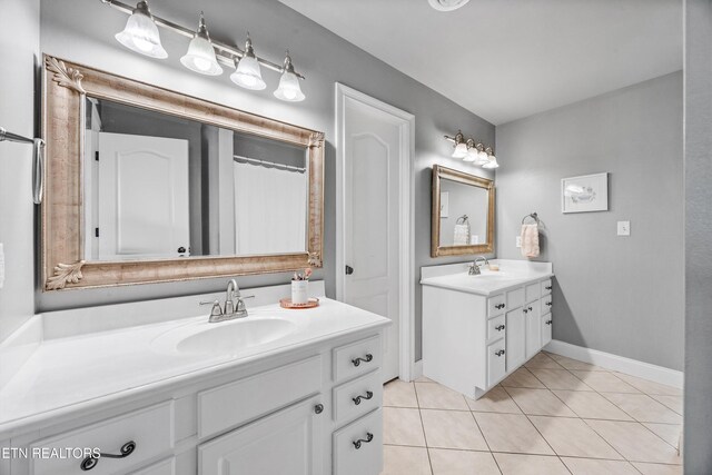 12332 Bonnybridge Ln, Knoxville, TN 37922 - bathroom with two vanities, tile patterned flooring, and baseboards