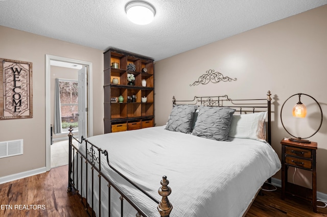 3325 Tekoa Mountain Way, Sevierville, TN 37876 - bedroom featuring wood finished floors, baseboards, and a textured ceiling