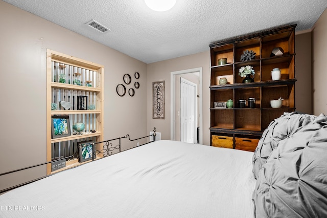 3325 Tekoa Mountain Way, Sevierville, TN 37876 - bedroom featuring a textured ceiling