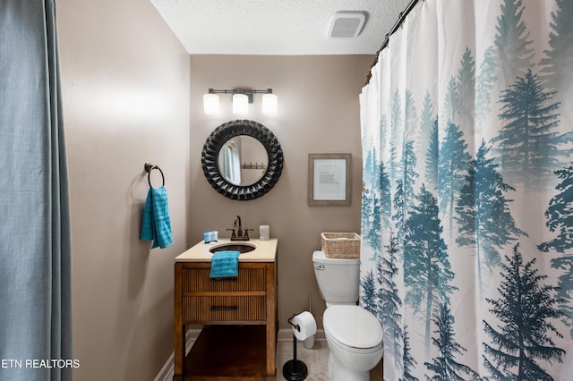 3325 Tekoa Mountain Way, Sevierville, TN 37876 - full bath with vanity, toilet, a textured ceiling, baseboards, and tile patterned flooring